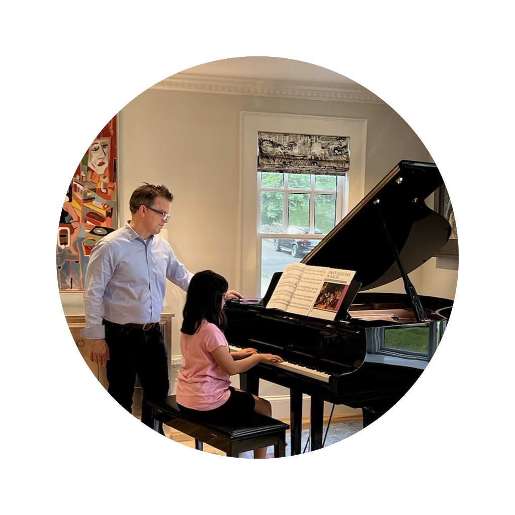 Gene Kelly working with a student sitting at the piano Gene Kelly working with a student sitting at the piano